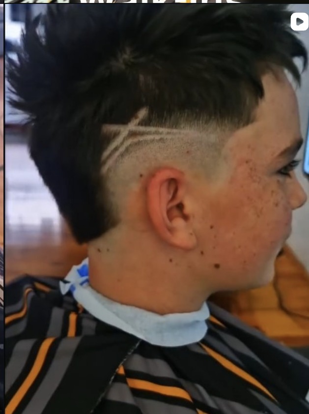 Spiky mullet with lightning lines razored into the fade